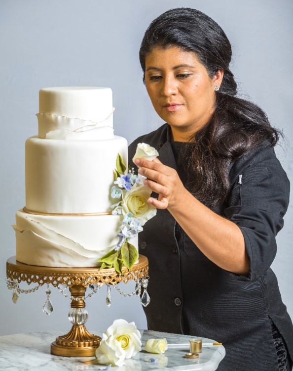 Photo of Angela making a cake, Arkansas Heart Hospital careers 